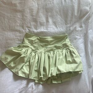 Gold hinge Green skirt